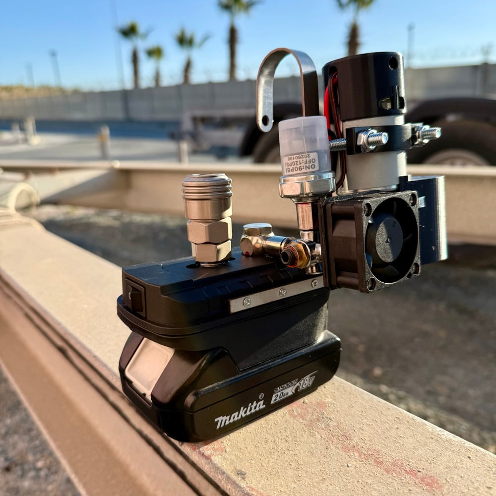 Cordless mini compressor on a Makita 18V battery